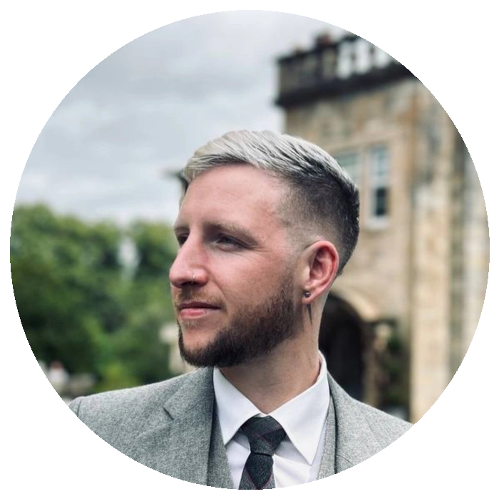 Steven Gillies, founder of Scotsman Travels, with a Scottish castle behind him